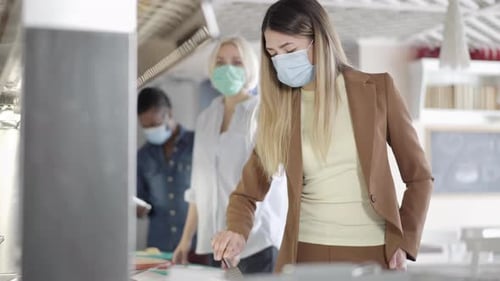 Workers Wearing Face Masks in the Office