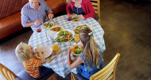 Family Mealtime: Overhead View of a Happy Family Dining