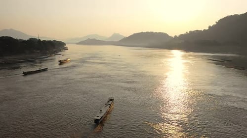 Aerial View Of Boat In Mekong River During Sunset