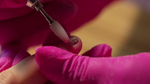 Manicurist Works On Finger Nail Up Close