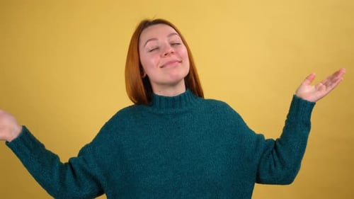 Young Woman 20s Dancing on Isolated Yellow Background Studio Shot in Slow Motion