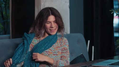 Happy Blogger Girl Talking on Laptop Sitting in Cafe