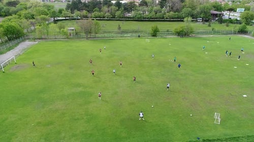 Aerial View of Soccer Practice on Green Field