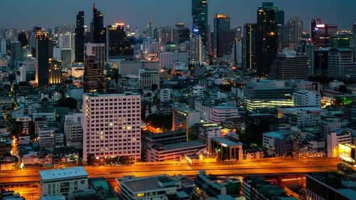 Time Lapse Night Cityscape and Highrise Buildings in Metropolis City Center
