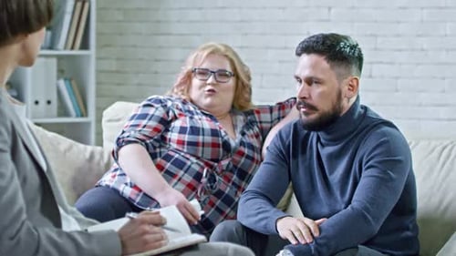 Couple Talks To Therapist in Counseling Session