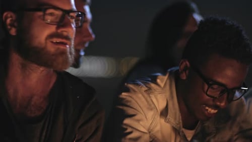 Friends Gather and Talk at Night