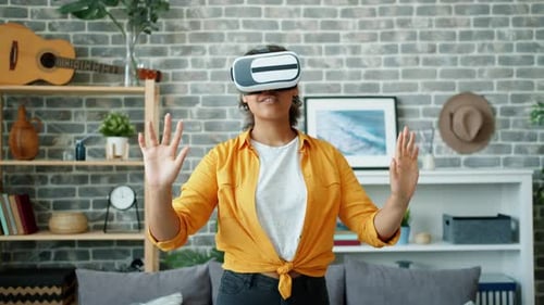 Woman Using VR Headset in Living Room