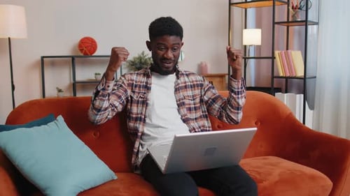 Young Adult Man at Home Office Use Laptop Pc Typing Browsing Say Wow Yes Found Out Great Big Win