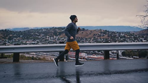Man Running In The Rain