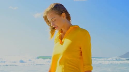 Woman walking on the beach 4k