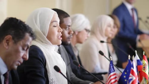 Diverse Group Discussing at International Meeting