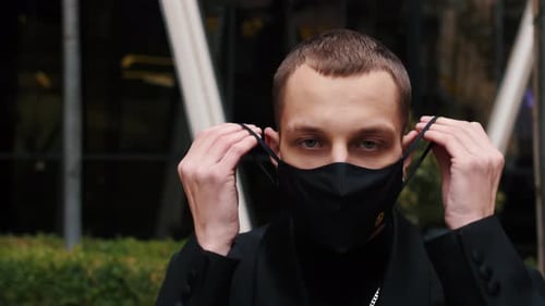 Portrait Man Wearing Protective Face Mask Look at Camera COVID-19 Coronavirus Infection Near Airport