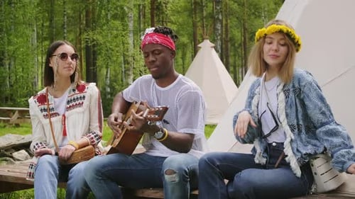 Young Adults Play Music Together Outdoors