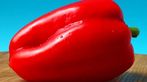 Vibrant Red Bell Pepper Zooming on Cutting Board