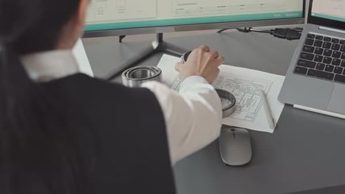 Female Engineer Developing Equipment Details in Office