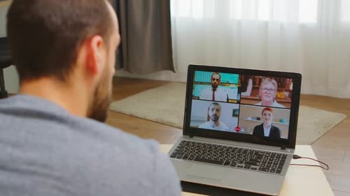Man in Virtual Meeting with Four Participants