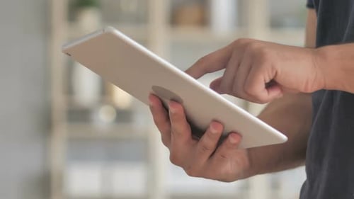 Man Working on Tablet