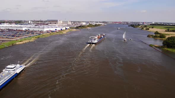 Inland Freighter Barges Sailing In The Oude Maas River At Daytime In ...