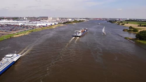 Inland Freighter Barges Sailing In The Oude Maas River At Daytime In Area Of Zwijndrecht, Netherland