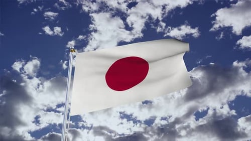 Waving Japanese Flag Against Blue Sky with Clouds