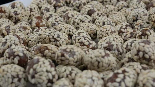 Delicious Date Candies Coated in Sesame Seeds