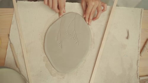 Hands Shaping Ceramic Clay in Pottery Studio
