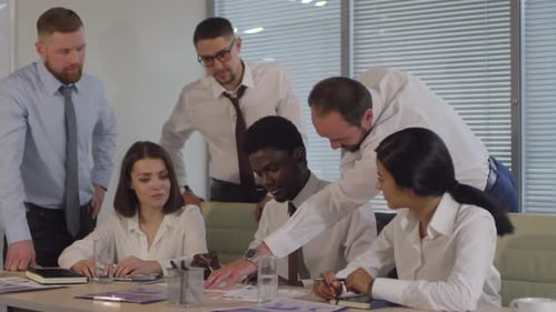 Multiethnic Team of Colleagues Brainstorming in Office