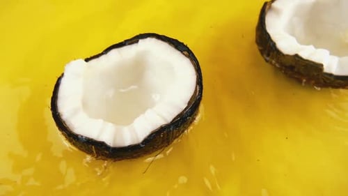 Close Up of Coconuts on a Yellow Surface