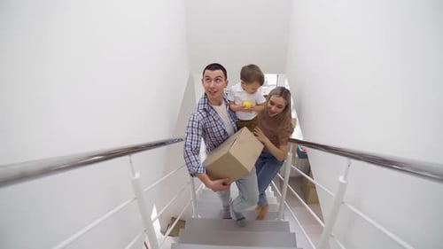 Loving Family Moving into Modern Home