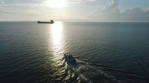 Fishing Boat And Cargo Ship Aerial