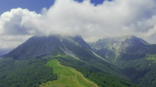 Beautiful Landscape with Alpine Mountain and Clouds