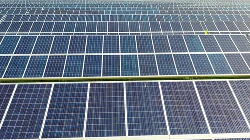 Aerial View of a Solar Panels Stand in a Row in the Fields Green Energy Landscape Electrical Power