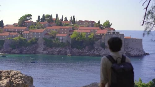 A Man Traveler Visits the Sveti Stefan Island