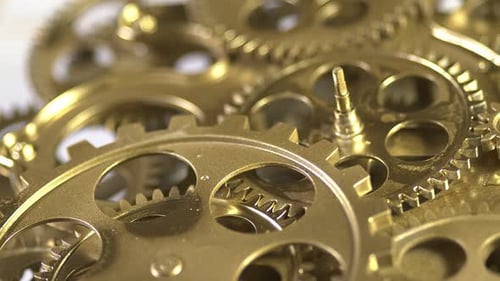 Gold Gears Turning in Intricate Mechanical System