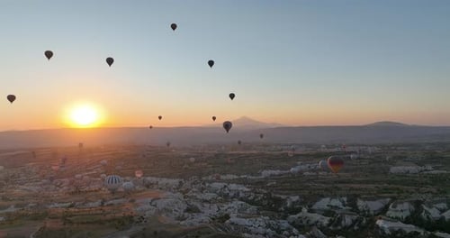 Aerial Cinematic Drone View of Colorful Hot Air Balloon Flying Over Cappadocia
