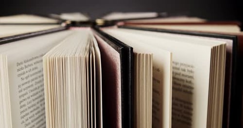 Books Open in a Circle, Close Up Shot