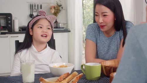 Family Enjoying Breakfast Together at Home