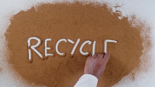Hand Writes Recycle in Powder Top Down