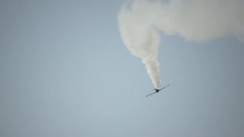 Jet Plane Performing Aerobatics with Smoke Trails