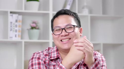 Smiling Young Adult Talking Indoors