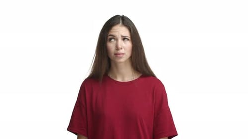 Cute Brunette Girl in Red Tshirt Making Decision Looking Indecisive Left and Right and Then Starting
