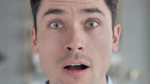 Face Close Up of Young Man in Shock, Wondering