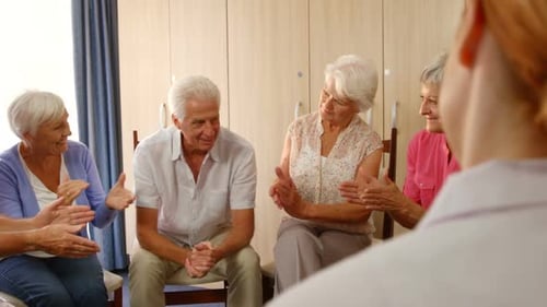 Seniors Clapping and Smiling in Community Circle