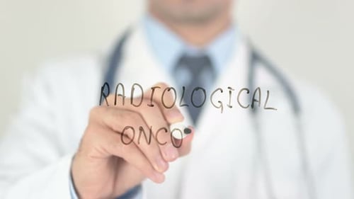 Doctor Writing Radiological Oncology on Clear Surface