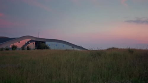 Beautiful Grass Field Landscape Grow By Big Building