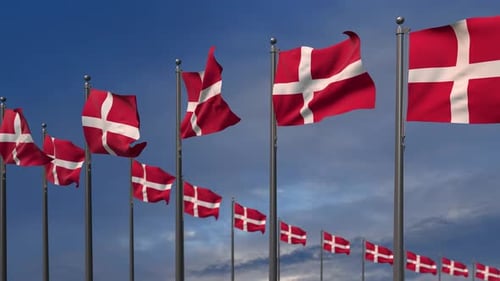 Waving Flags of Denmark on Poles Against Blue Sky