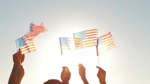 People Waved American Flags.