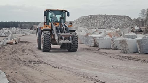 Heavy Wheel Loader Driving in Quarry