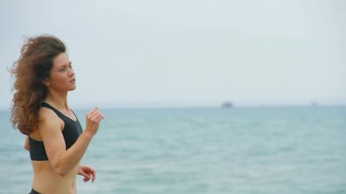Woman Running on Beach, Health and Fitness