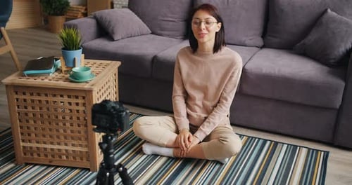 Young Woman Recording Vlog at Home on Camera